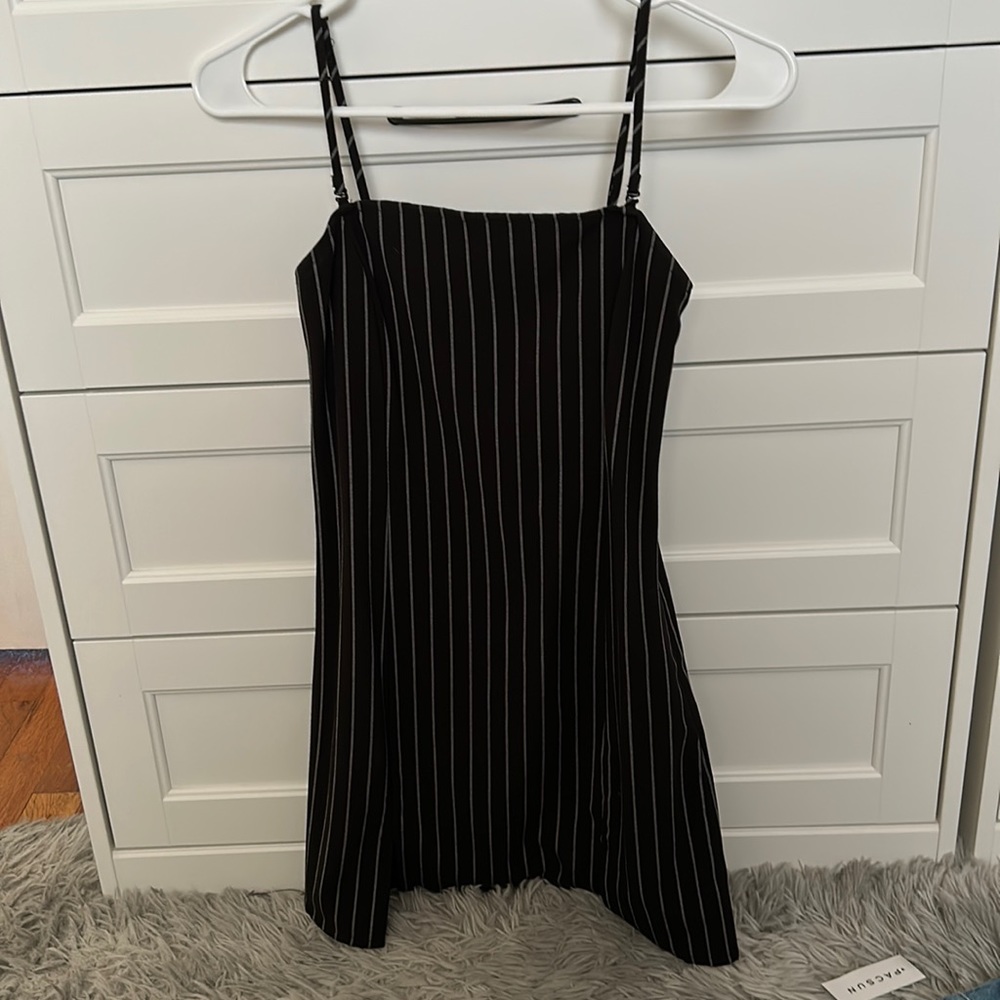 Black and white striped dress. Has a slit.